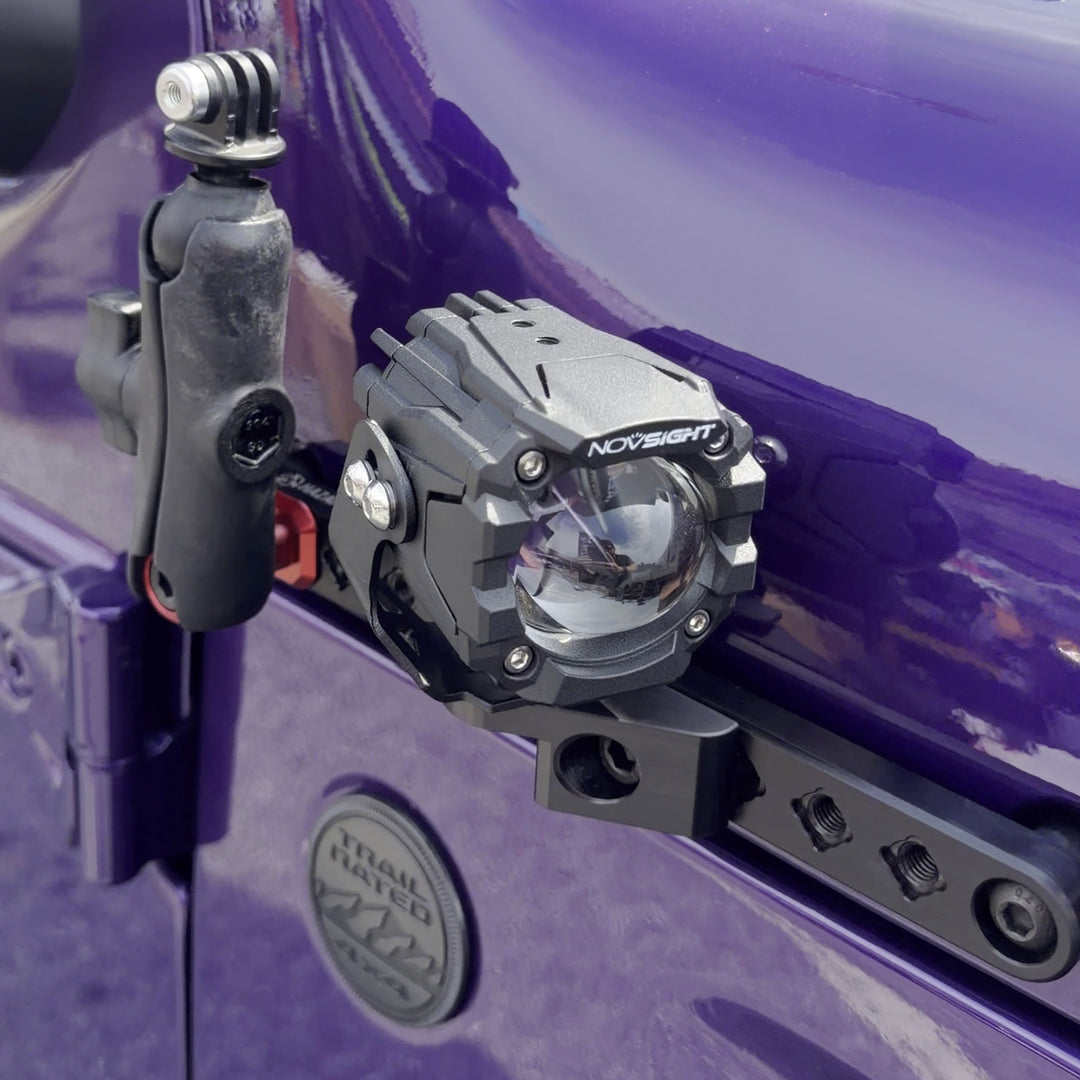 HazardKey cowl side rail on a purple Jeep Wrangler JL with an LED pod light and a 1 inch ball mount holding a camera arm