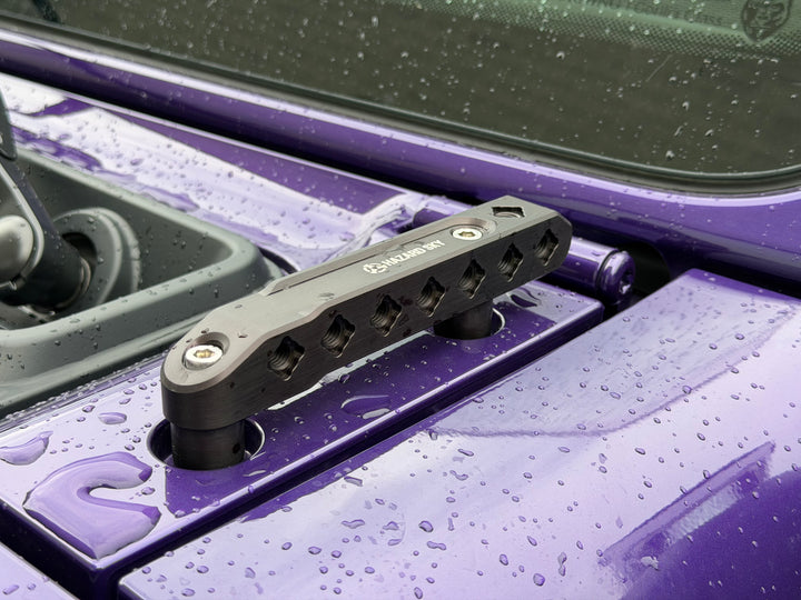 Black HazardKey cowl top accessory rail installed on the cowl of a purple Jeep Wrangler JL