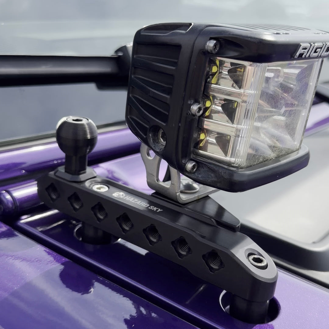 HazardKey cowl top rail on a purple Jeep Wrangler JL with an LED cube light and a 1 inch ball mount
