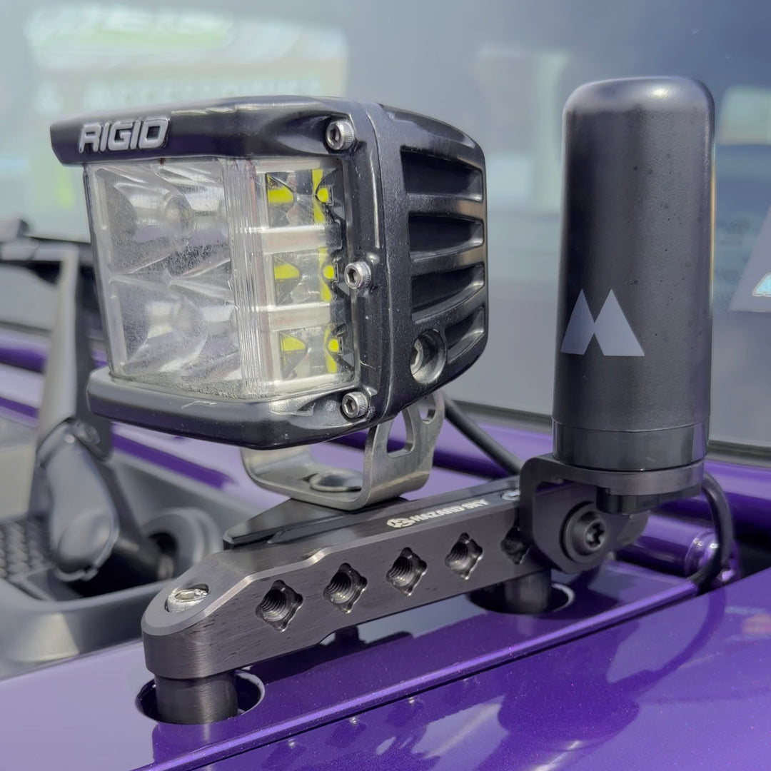HazardKey cowl top rail on a purple Jeep Wrangler JL with an LED cube light and a GMRS antenna on the NMO mount